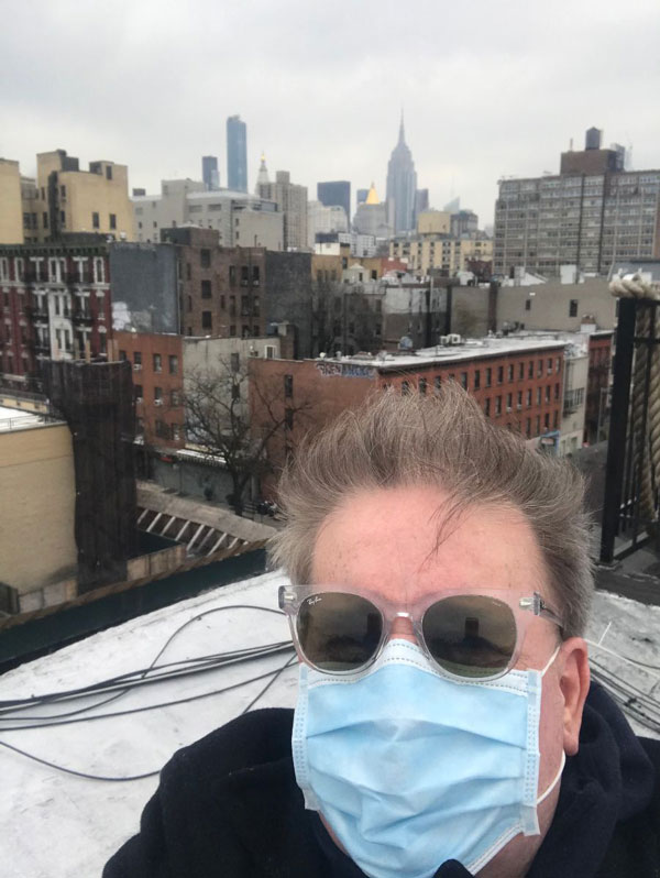 Pierce Turner on the roof on 1st Ave in a deserted East Village on 3/30/2020 during the Coronavirus (COVID-19) outbreak in New York City - 'Up on the roof, it feels like I'm getting away from the little bugger.'