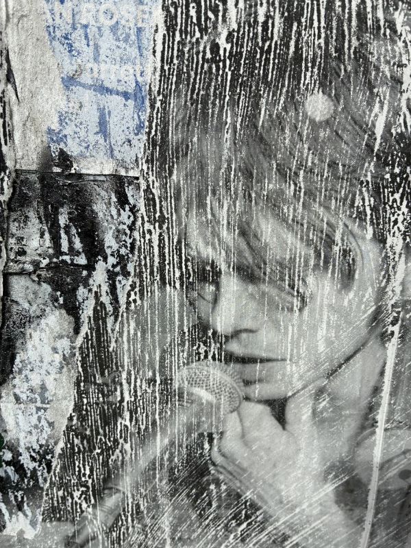 Art is everywhere in the Village, this is the remains of something faded by the weather, on the side of a mailbox.